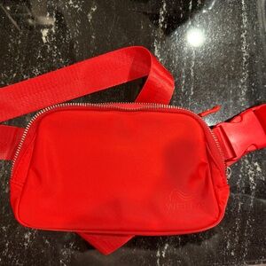 Wella brand belt bag in red